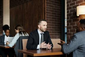 Two Men Talking in a Restaurant