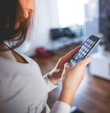 Woman Looking At Apps on a Smart Phone